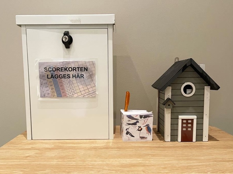 Scorekortslåda i damrummet